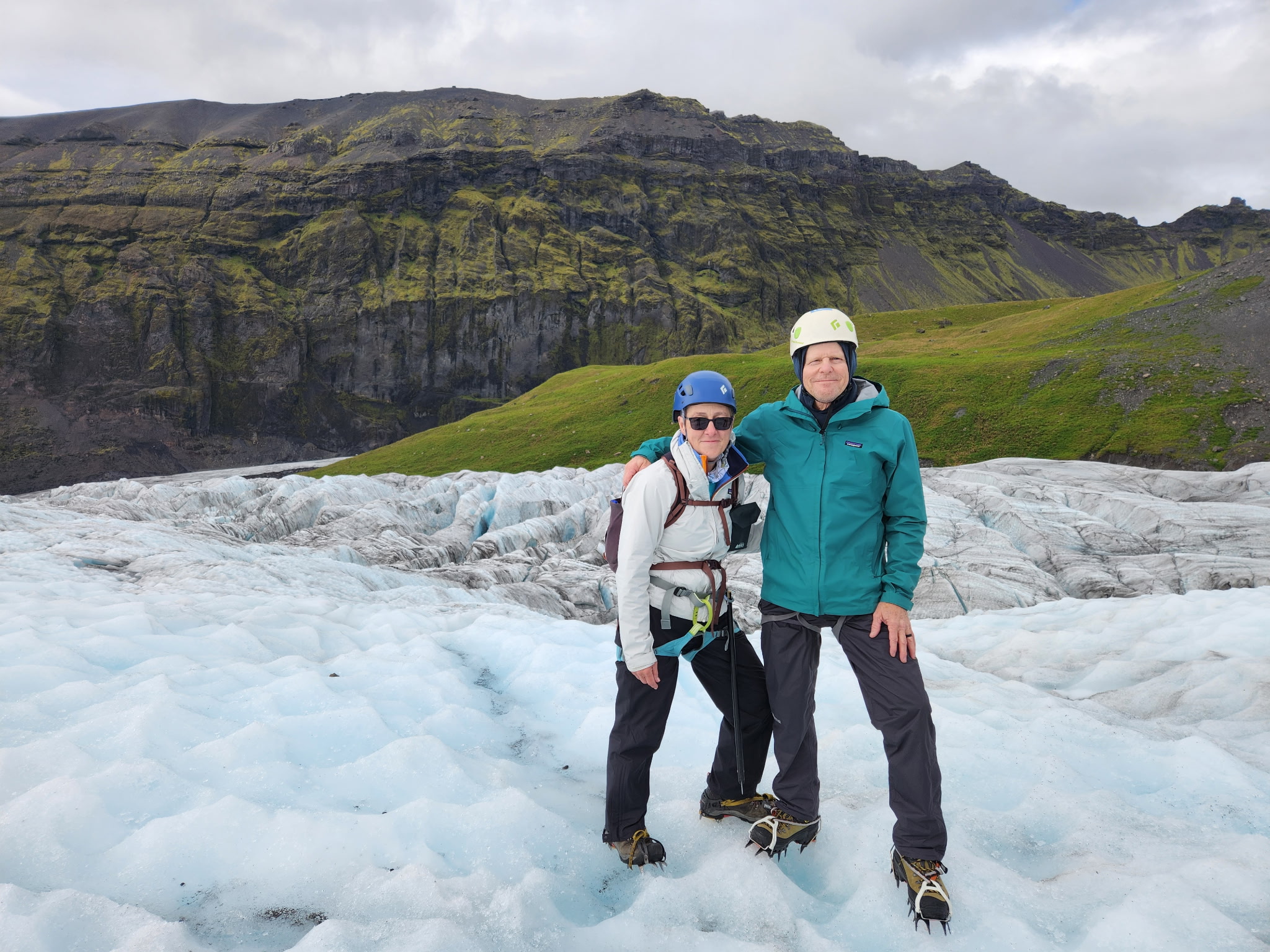 two people on a glacier